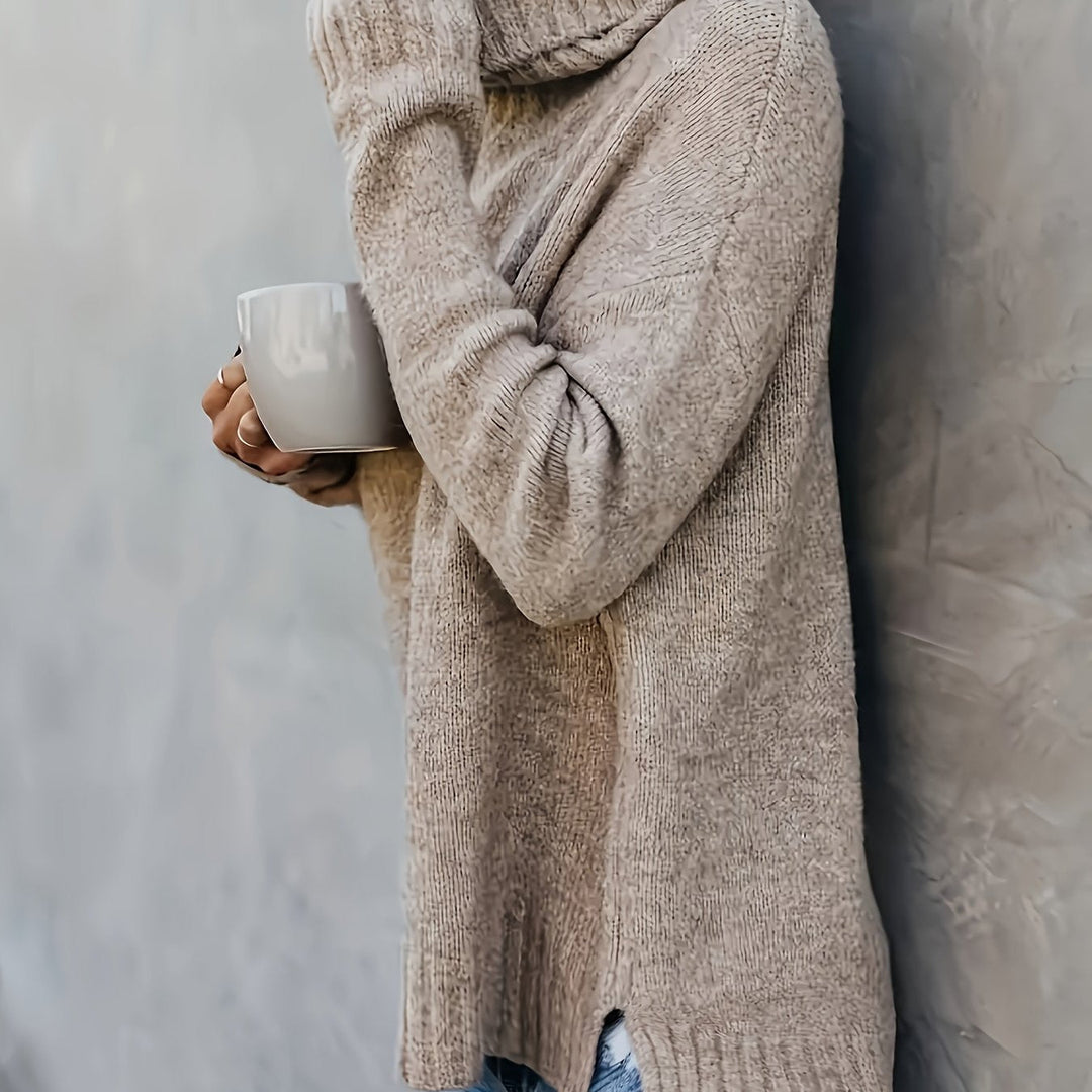 Soft knit women's turtleneck sweater, relaxed fit, side split hem. Ideal for a cozy and casual outfit.