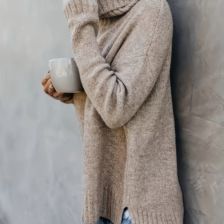 Soft knit women's turtleneck sweater, relaxed fit, side split hem. Ideal for a cozy and casual outfit.