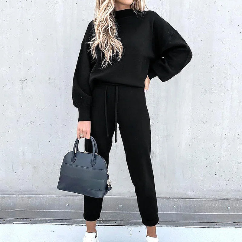 Women's cozy two-piece tracksuit in soft fabric, perfect for loungewear & ultimate comfort.