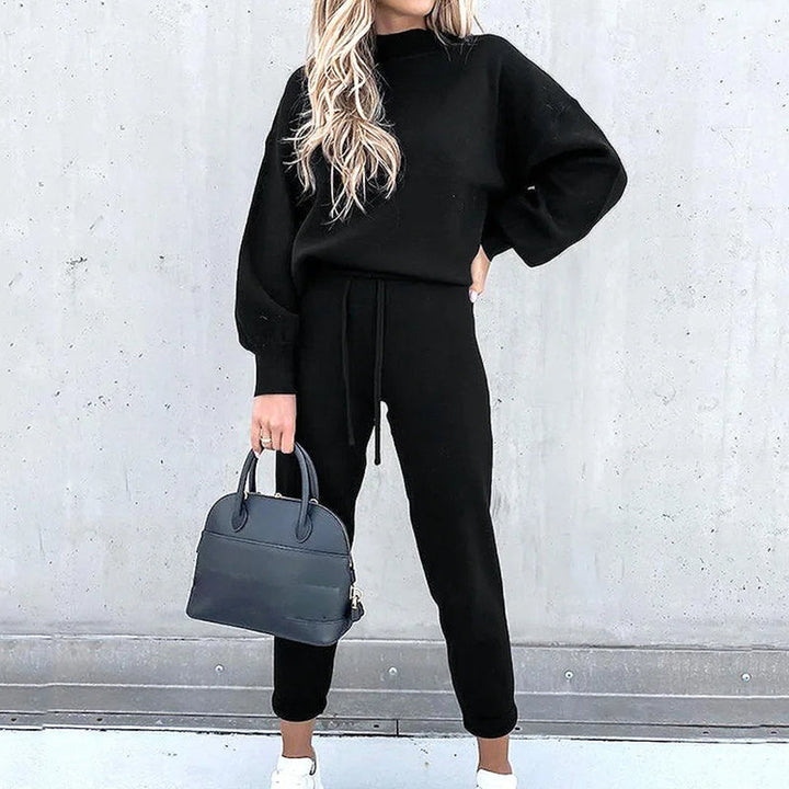 Women's cozy two-piece tracksuit in soft fabric, perfect for loungewear & ultimate comfort.