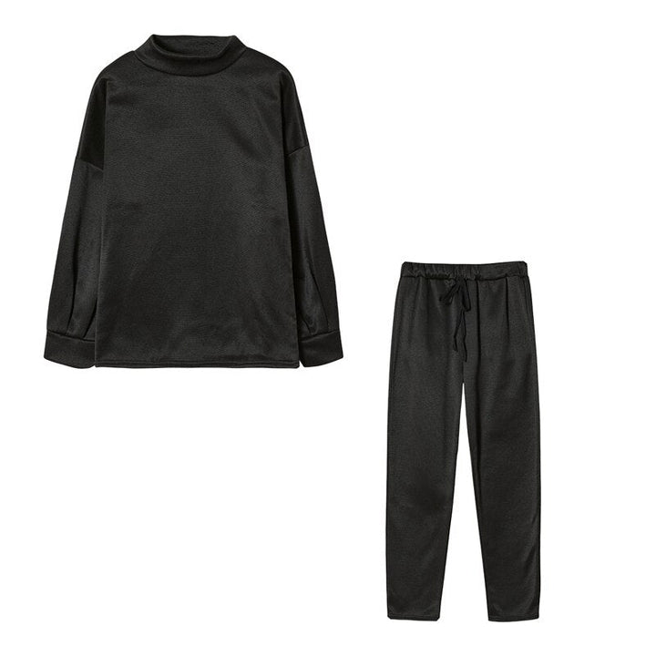 Women's relaxed fit tracksuit, two-piece comfort wear with high collar & soft fabric.