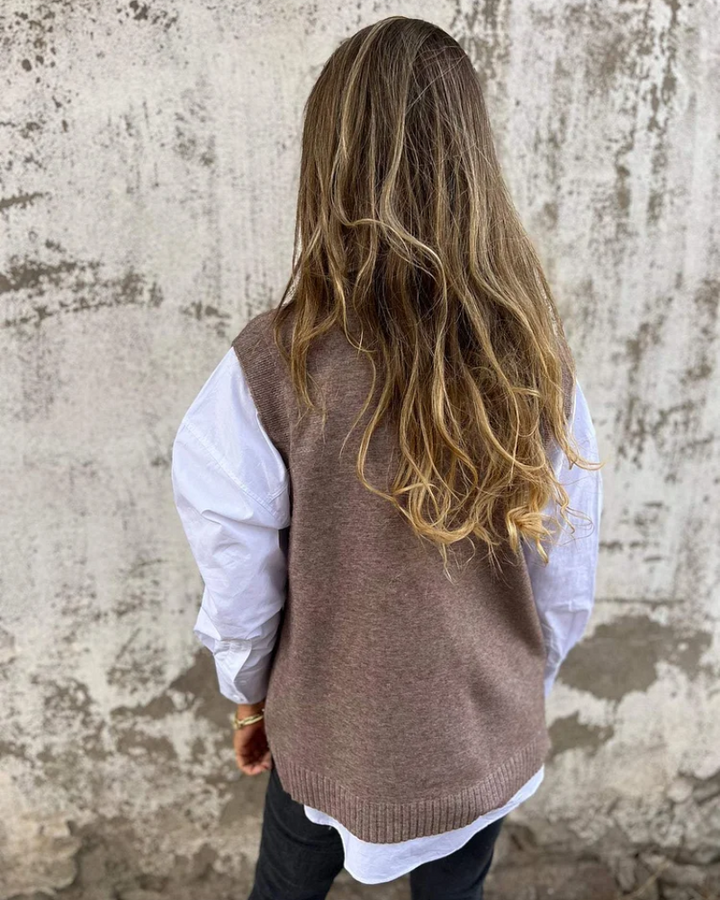 Soft black V-neck cardigan for women, a cozy long-sleeve layering piece perfect for fall and winter style.