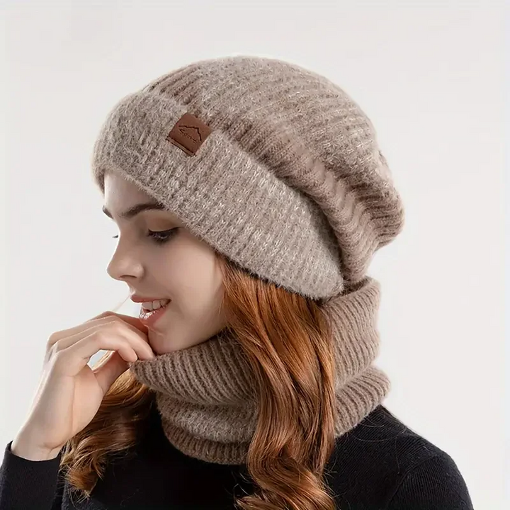 Women's cozy winter beanie & scarf matching set, perfect for warmth in cold weather.