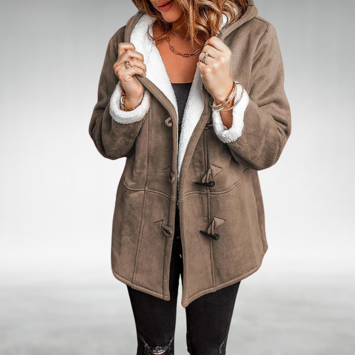 Fashionable women's long winter coat with a protective hood and classic toggle fasteners.