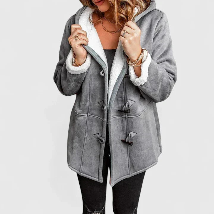 Women's cozy winter coat with stylish toggle closure. Warm hooded outerwear for cold weather and casual fit.