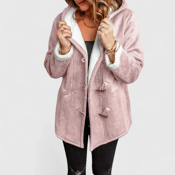 Stylish women's hooded winter coat. Cozy toggle closure jacket, perfect for cold weather seasonal fashion outerwear.