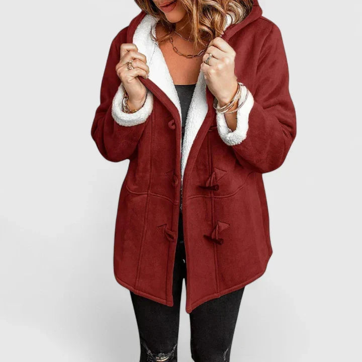 Comfortable women's toggle closure winter coat. Hooded, cozy jacket for cold weather and stylish casual outerwear.