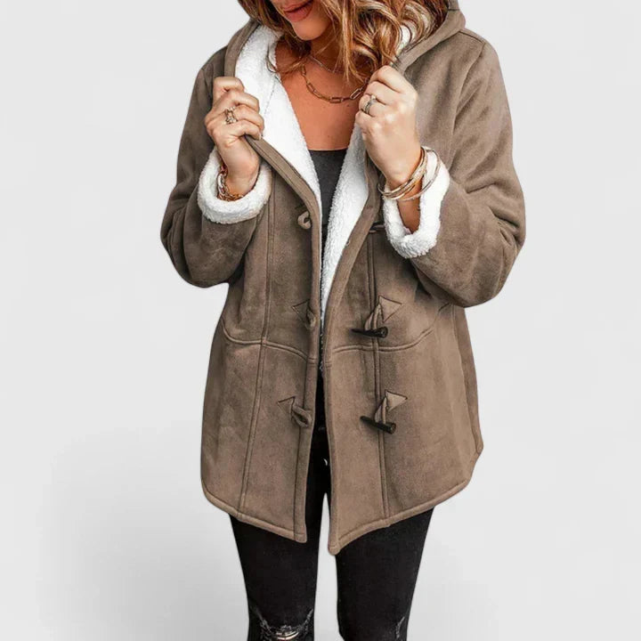 Elegant women's winter coat with toggle closure. Cozy hooded outerwear, ideal for stylish cold weather fashion.