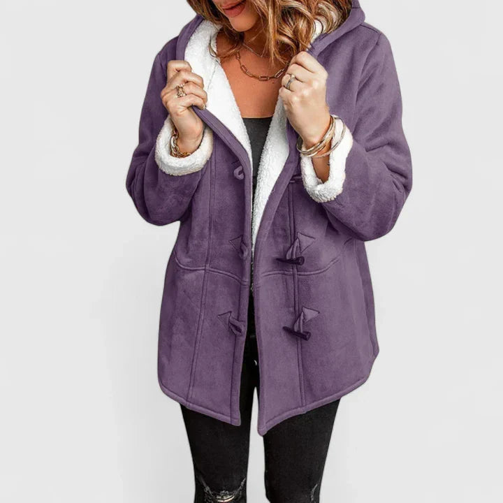 Fashionable women's hooded winter coat with toggle closure. A cozy jacket for stylish cold weather outerwear.