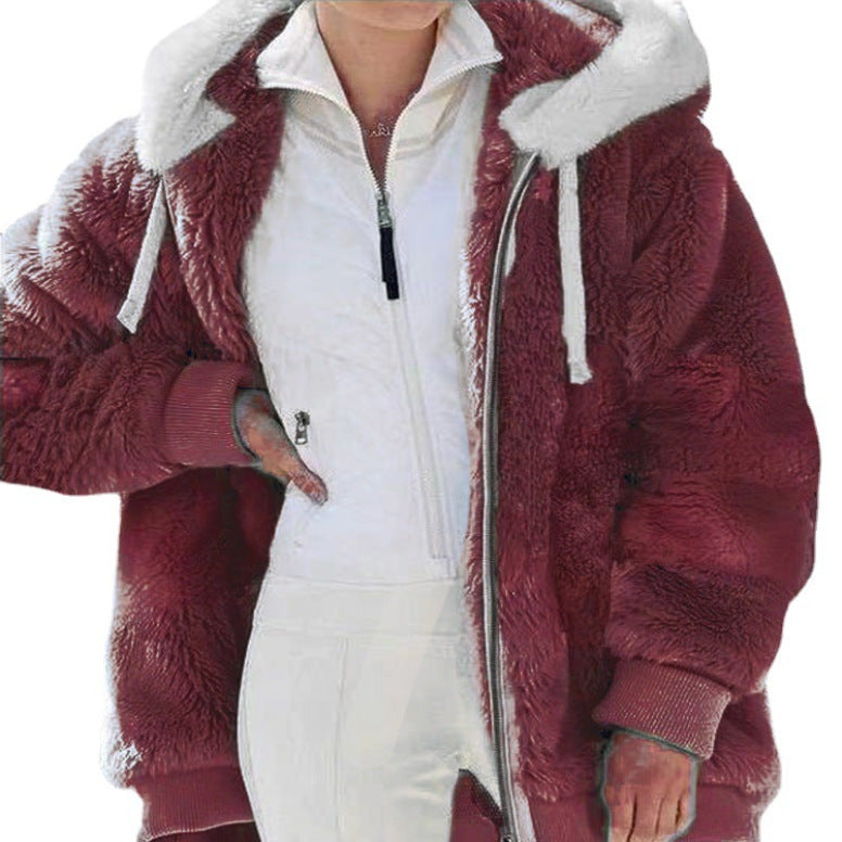 Woman walking in a warm, hooded, zippered winter jacket, showcasing everyday style.
