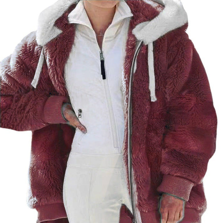 Woman walking in a warm, hooded, zippered winter jacket, showcasing everyday style.