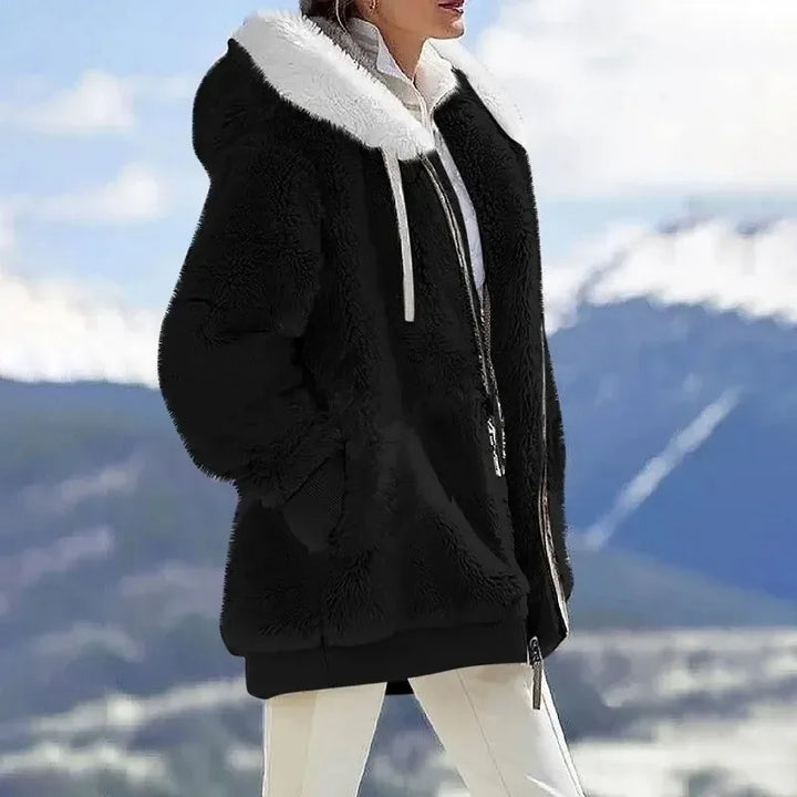 Women's striped winter jacket, hooded & zippered, offering cozy warmth and casual fall fashion.