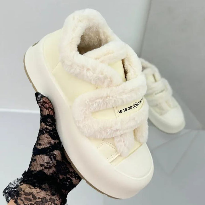 Women's comfortable winter slip-on shoes. Cozy, warm footwear with modern strap for stylish daily wear.