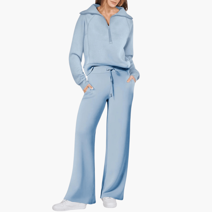 Soft women's two-piece lounge set featuring a zip-up hoodie and wide-leg pants. Ideal cozy outfit.
