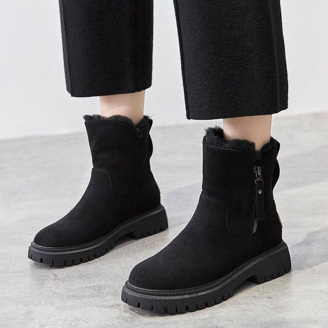 Women's CozyStride insulated winter boots with zip closure for cold weather comfort and warmth.