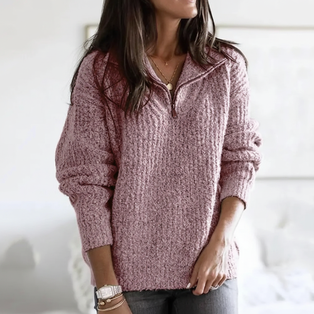 Close-up of soft fabric texture on a women's half-zip knitted autumn sweater, ideal for winter
