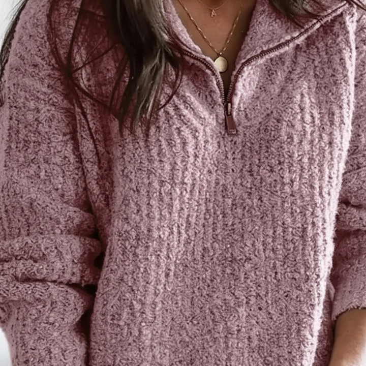 Woman wearing a stylish off-white half-zip knitted autumn sweater, showcasing casual fashion