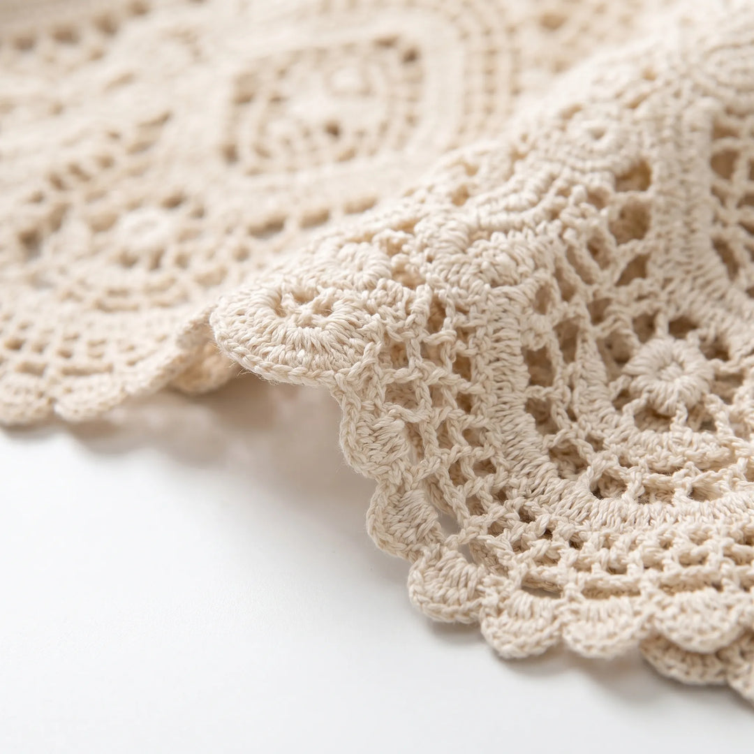 Casual women's open-front crochet-style cardigan, light white fabric, perfect for summer beach days or bohemian outfits.