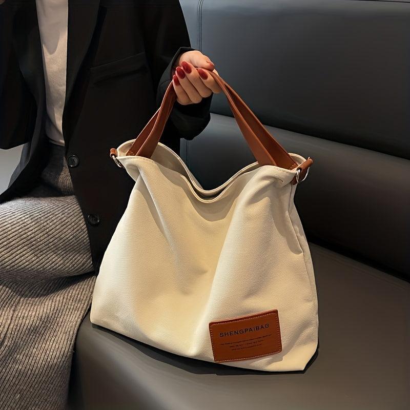 Versatile women's canvas shoulder bag, perfect for everyday wear, can be styled cross-body.