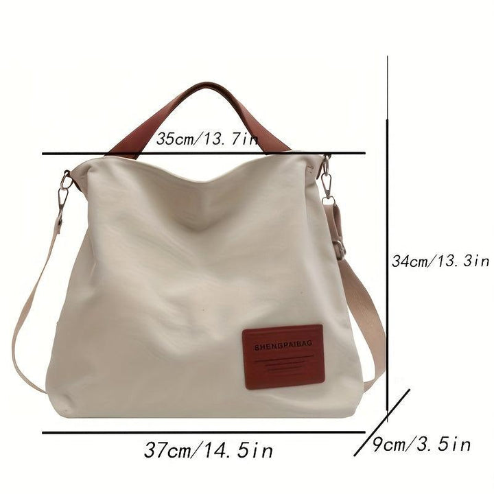 Durable cream white canvas shoulder bag for women, ideal everyday accessory with versatile styling.