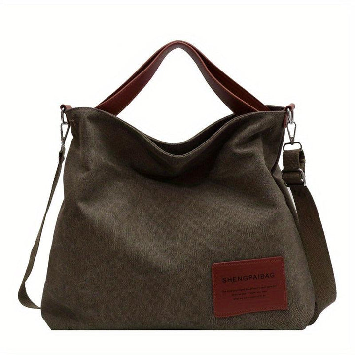 Stylish women's cream white canvas shoulder bag, an everyday essential with cross-body versatility.