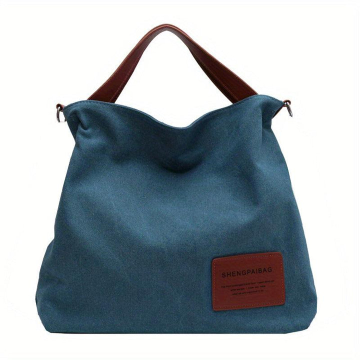 Chic women's cream white canvas shoulder bag, perfect for versatile everyday cross-body fashion.