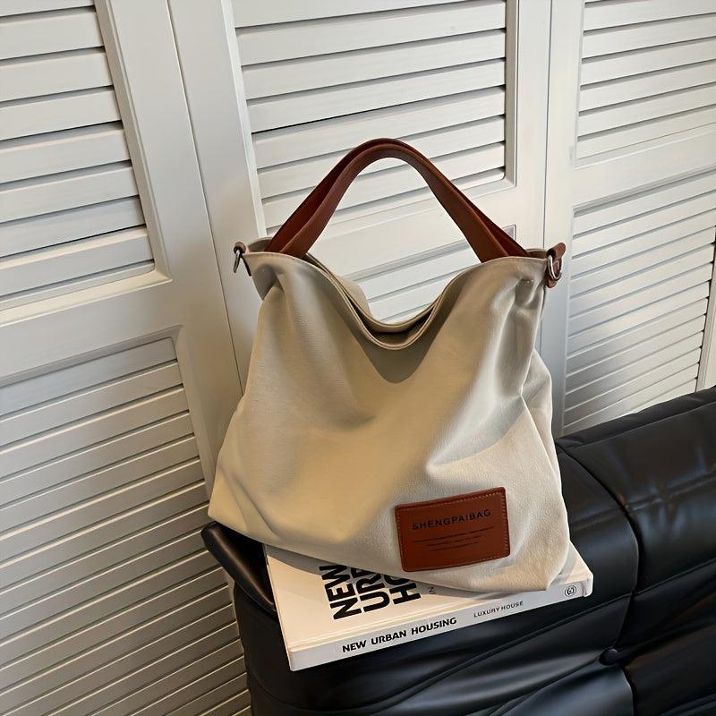 Everyday women's durable canvas shoulder bag, cream white, ideal for versatile cross-body styling.
