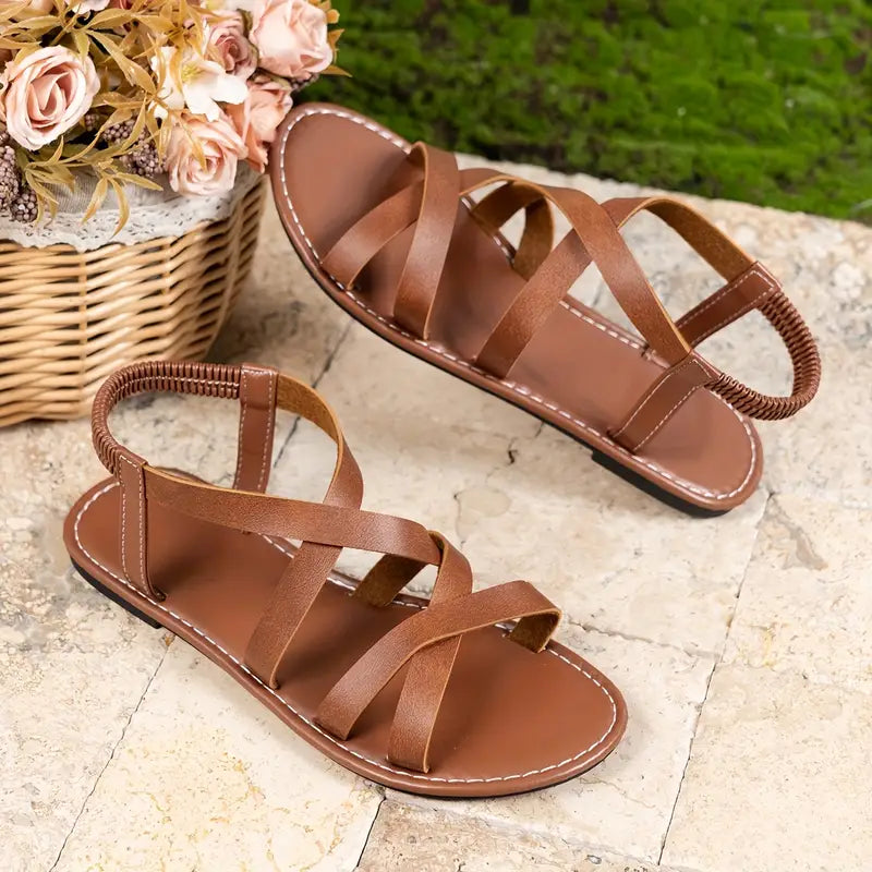 Trendy women's Roman flat sandals with elegant criss-cross straps, a must-have for your summer wardrobe.