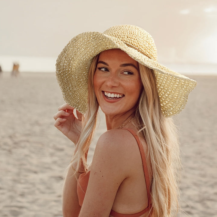 Women's crochet boho straw hat, perfect for summer travel & beach vacations.