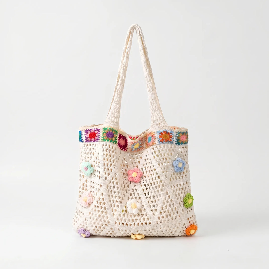 Boho crochet flower tote bag for women. Casual summer shoulder bag, ideal for everyday carry with a vibrant floral design.