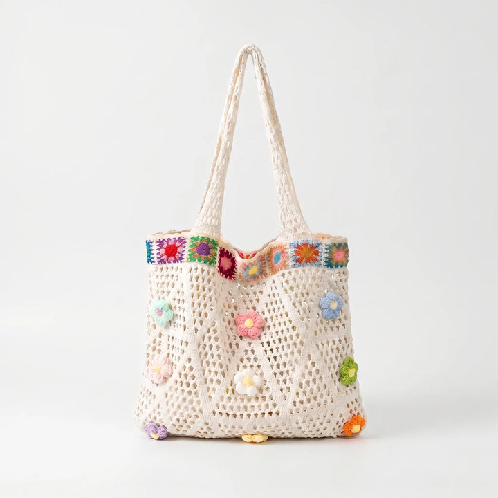 Boho crochet flower tote bag for women. Casual summer shoulder bag, ideal for everyday carry with a vibrant floral design.