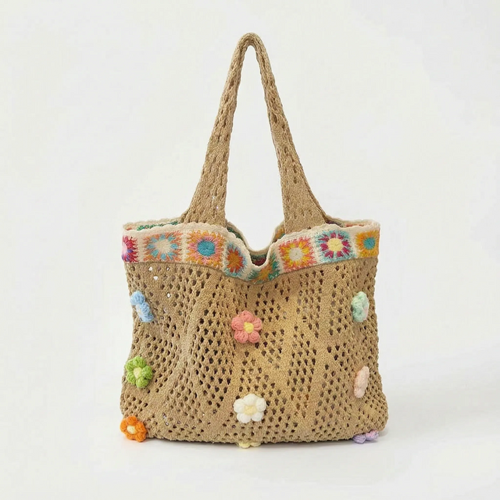 Vibrant women's flower crochet tote bag in a casual summer style. Perfect everyday carry shoulder bag with boho charm.