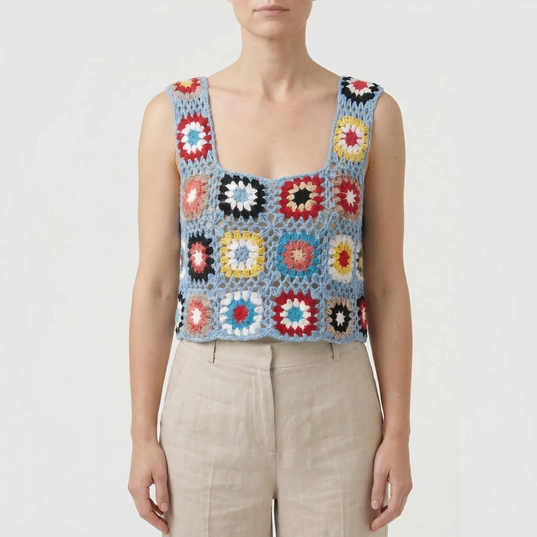 Vibrant open knit crochet crop top for women, sleeveless and boho chic, great for summer vacation.