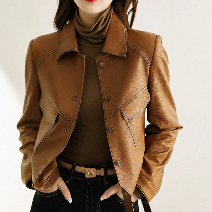 Women's cropped faux leather jacket with lapel collar. Chic modern fall fashion outerwear.
