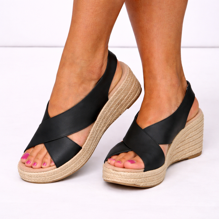 Women's crossover strap wedge sandals, combining stylish design with comfortable all-day wear for summer fashion.