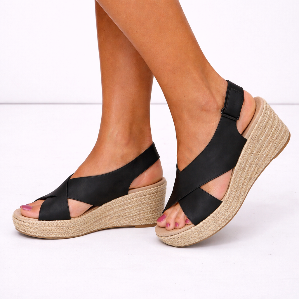 Fashionable women's wedge sandals. Enjoy comfortable support with stylish crossover straps & an open toe design.