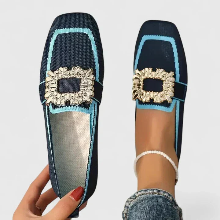 Slip-on women's flat loafers with a modern square toe and glittering crystal buckle. Comfortable & fashionable.