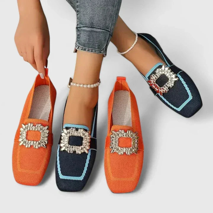 Fashionable women's square-toe flat loafers. These elegant slip-on flats boast a beautiful crystal buckle for sparkle.