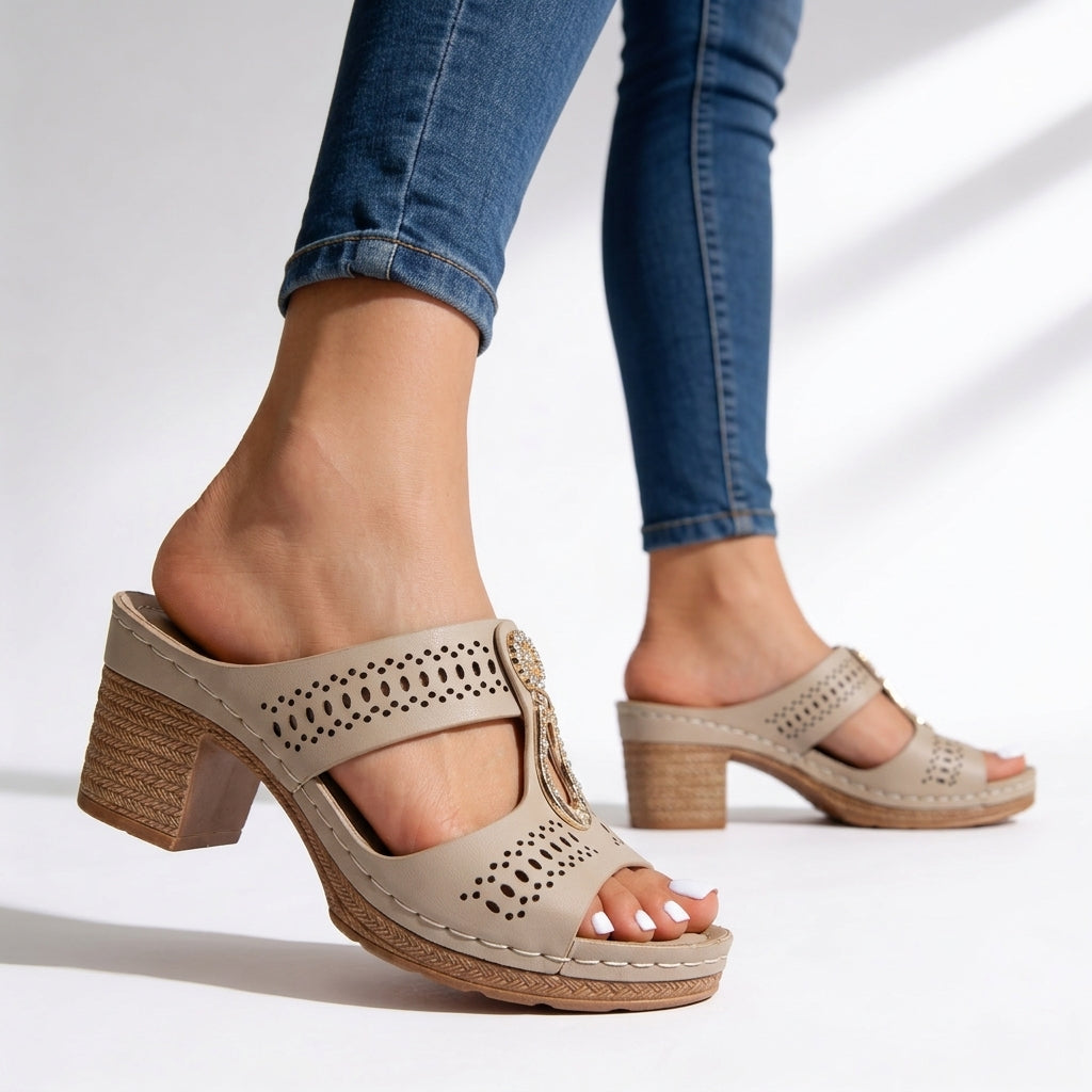 Chic women's open-toe block heel sandals. Features rhinestone T-strap & cushioned sole for elegant summer events.