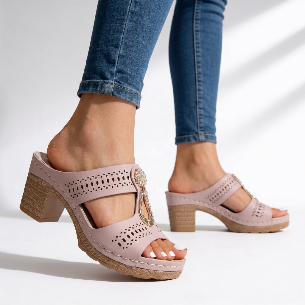 Slip-on women's block heel sandals, cushioned for comfort. Rhinestone T-strap adds elegant flair to casual chic outfits.