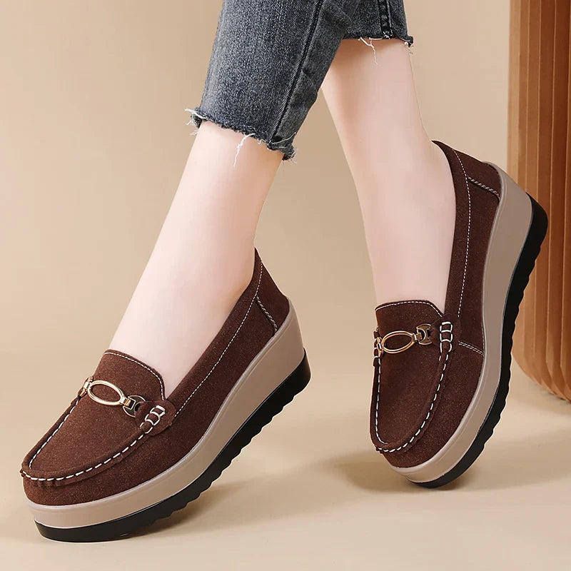 Black women's platform loafers. Cushioned slip-on shoes for women, offering both style and comfort.