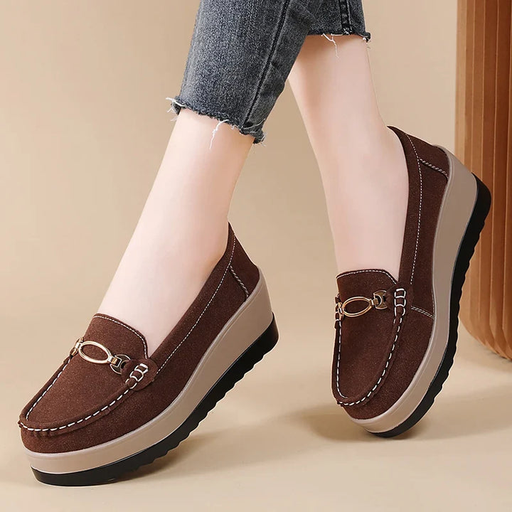 Black women's platform loafers. Cushioned slip-on shoes for women, offering both style and comfort.