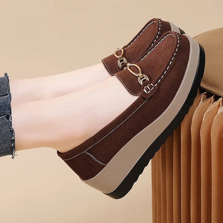 Front view of women's cushioned platform loafers, showcasing chic design & comfortable slip-on style.