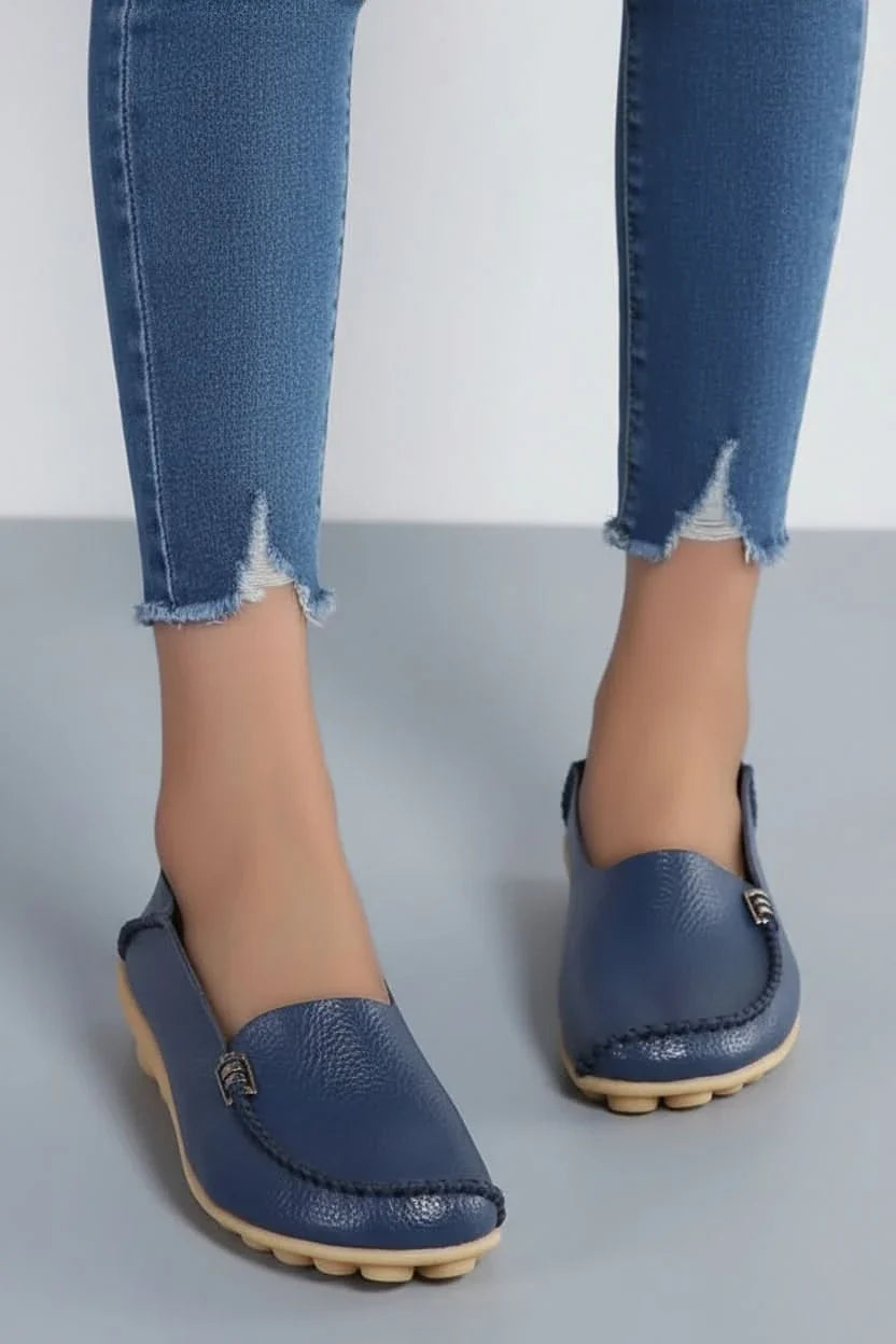 Versatile women's slip-on flat shoes with a round toe, perfect for casual or office comfort.