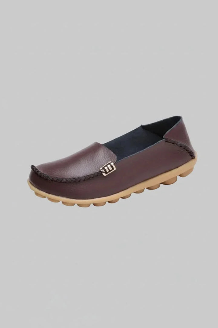 Professional yet casual women's flat shoes with a round toe, cushioned for all-day office comfort.