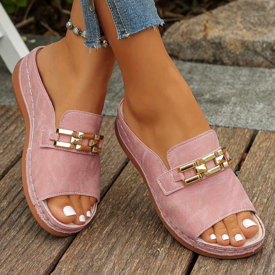 Women's cushioned slide sandals with stylish gold accent, perfect for summer comfort.