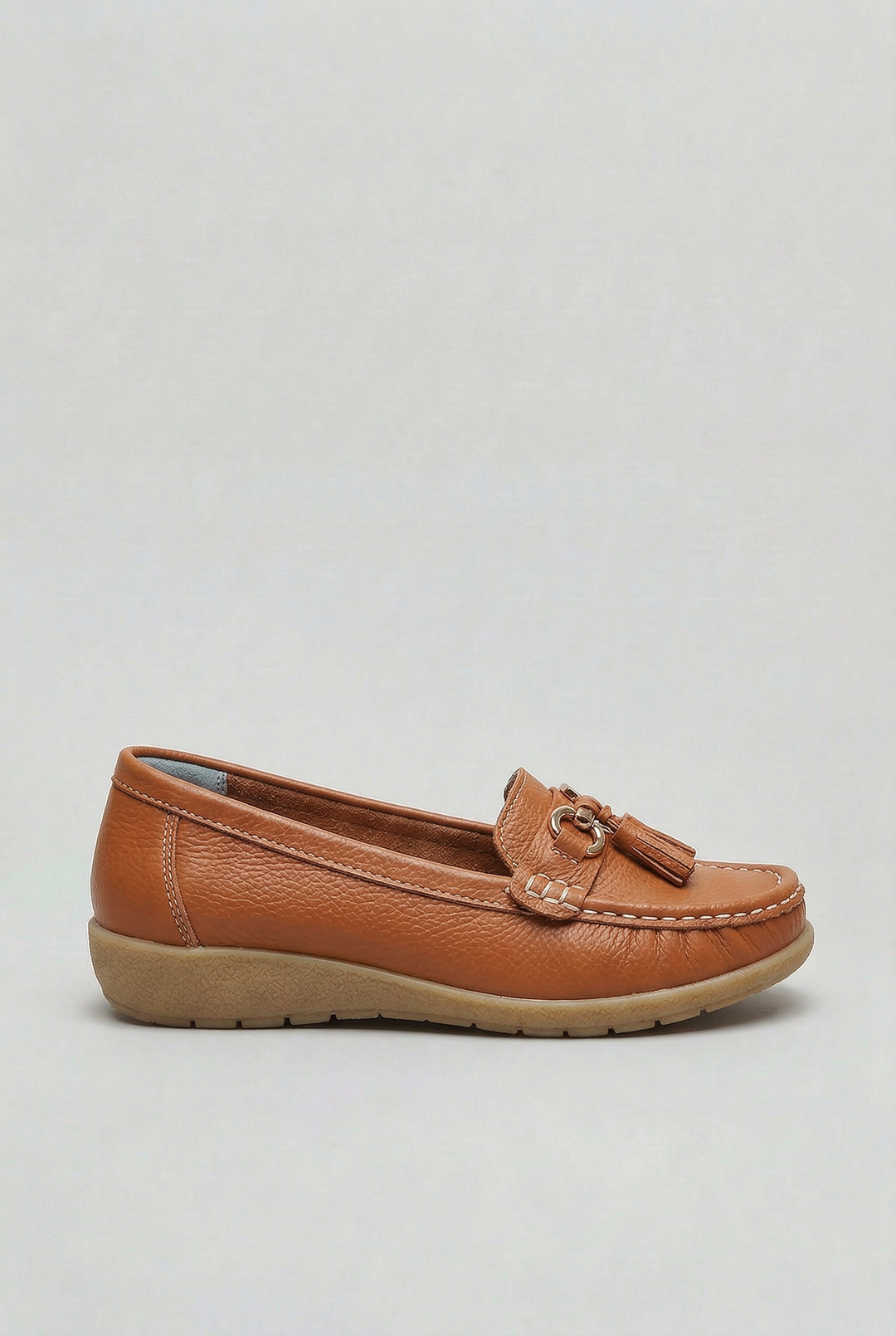 Side view of women's cushioned slip-on loafers, showcasing their classic design and comfort.