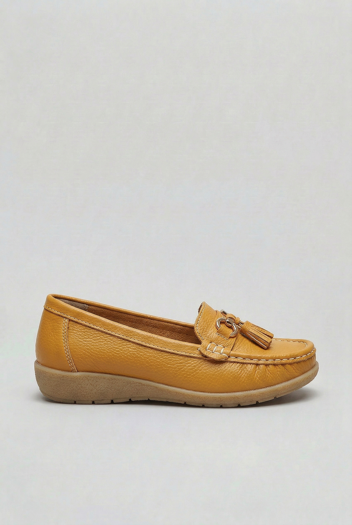 Top view of stylish women's slip-on loafers, emphasizing comfortable footbed & quality.