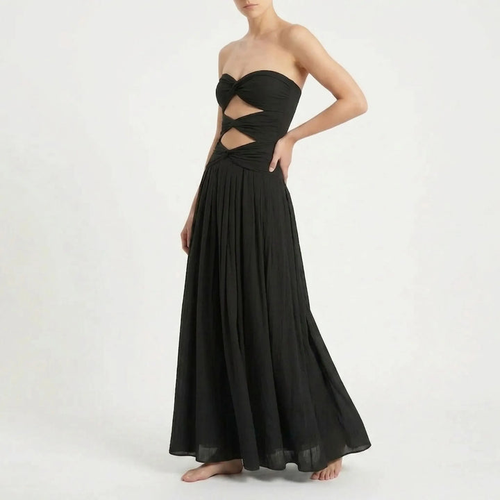 Women's stylish beach ensemble: cutout swimsuit with a lightweight long skirt cover-up.