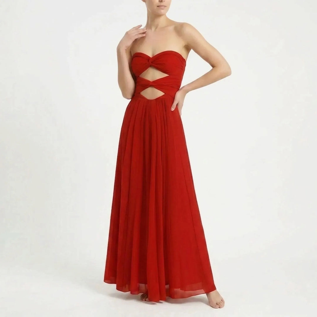 Elegant women's resort outfit: cutout swimsuit with a flattering long skirt cover-up.
